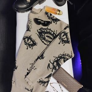 Beige Sweater with Black Abstract Design